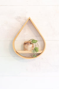 small wooden teardrop wall shelf