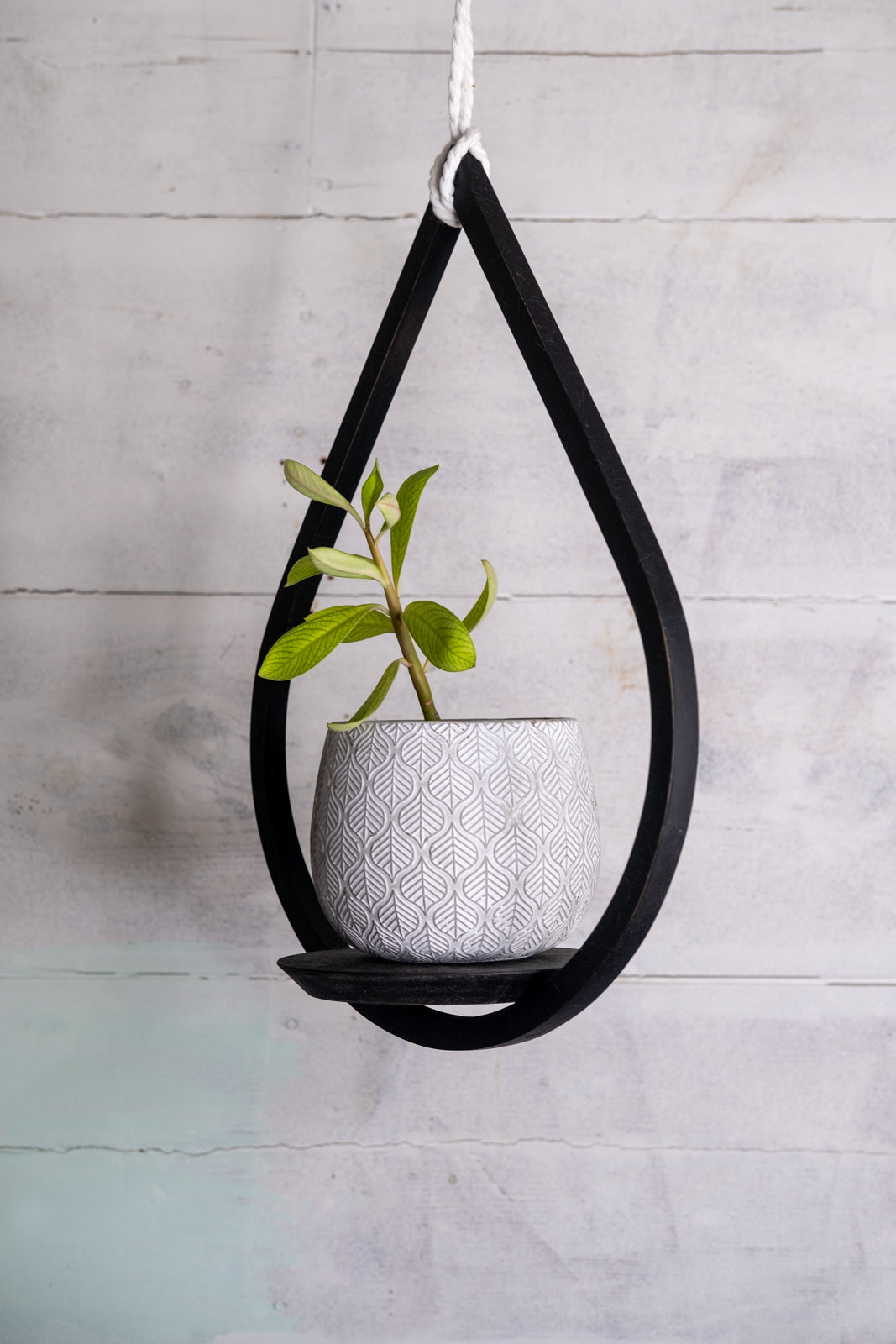 black wooden teardrop hanging planter from jute rope